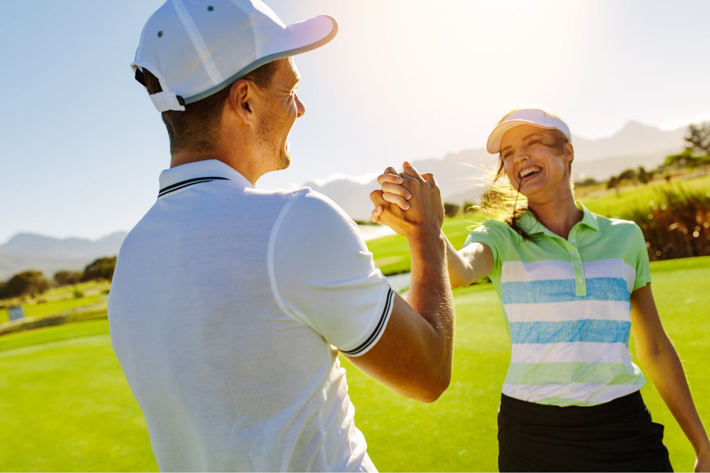 happy golfing man and women