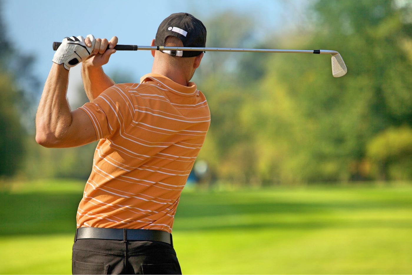 golfer swinging with club